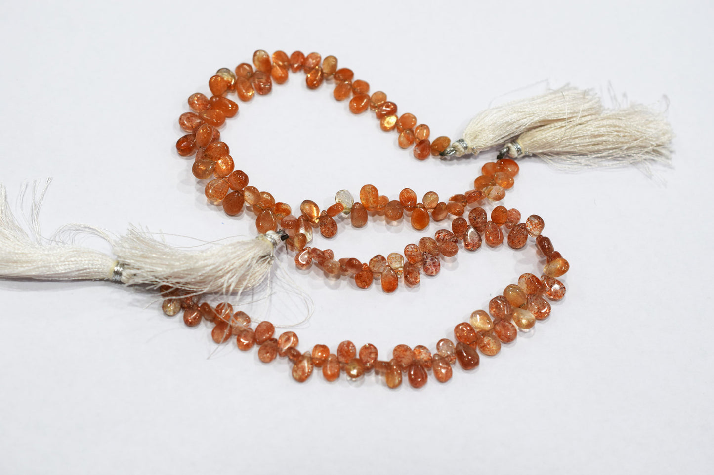 Sunstone Smooth Pear Shape Smooth Briolettes , Sold By Strand , 5x7 - 6x8 mm , 8" , 17568