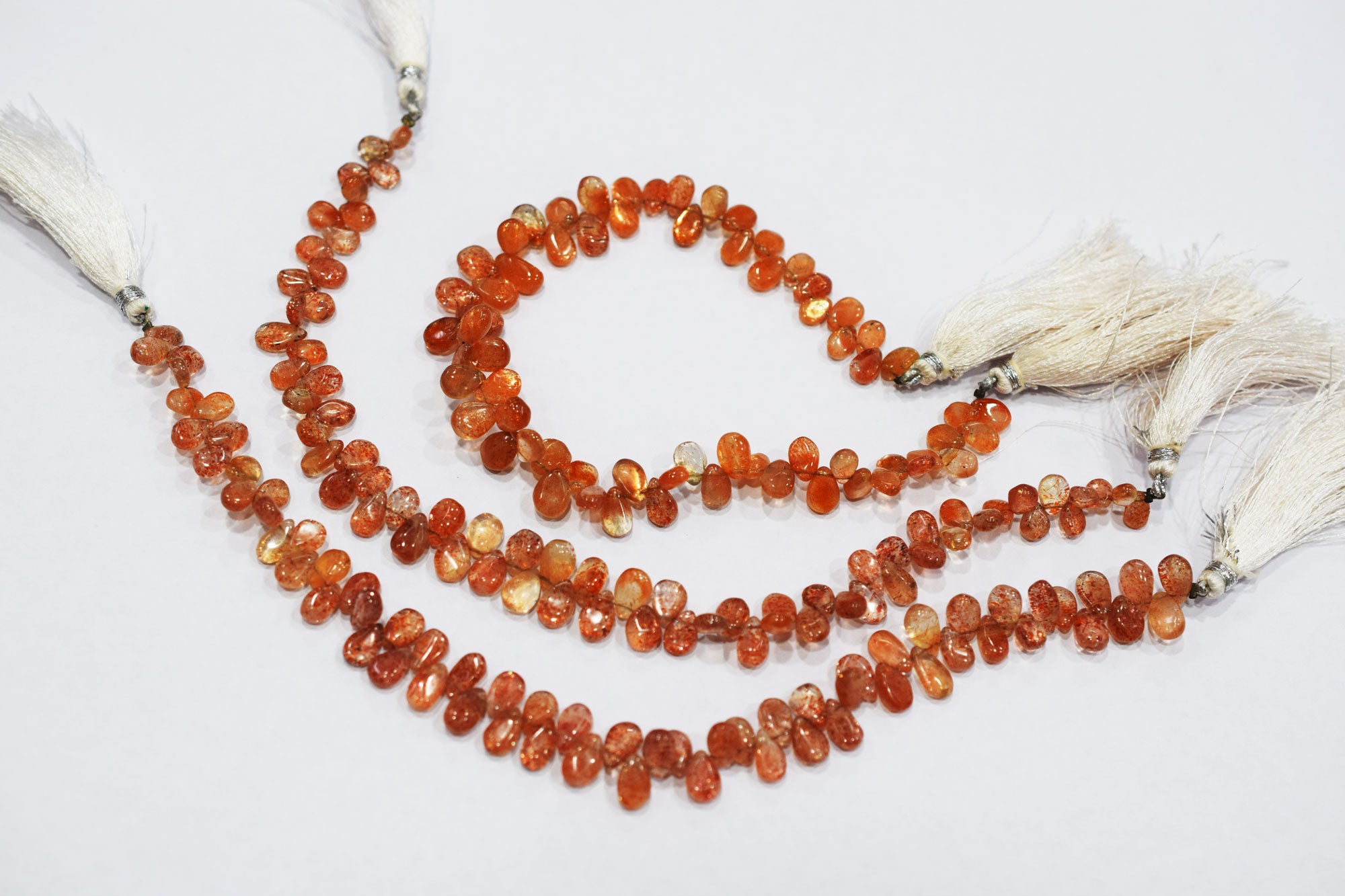 Sunstone Smooth Pear Shape Smooth Briolettes , Sold By Strand , 5x7 - 6x8 mm , 8" , 17568