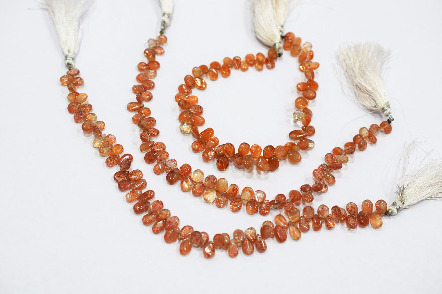 Sunstone Smooth Pear Shape Smooth Briolettes , Sold By Strand , 5x7 - 6x8 mm , 8" , 17568
